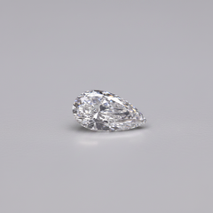 Pear-shaped diamond on a gray background