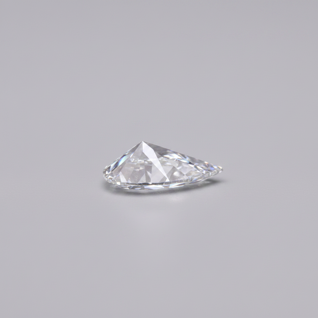 Triangular cut diamond on a gray background