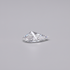 Triangular cut diamond on a gray background