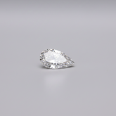 Pear-shaped diamond on a gray background