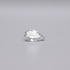 Pear-shaped diamond on a gray background