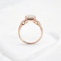 bezel-emerald-moissanite-engagement-ring-pear-side-sparkle-stones-3-ct-rose-gold-gemfora-4
