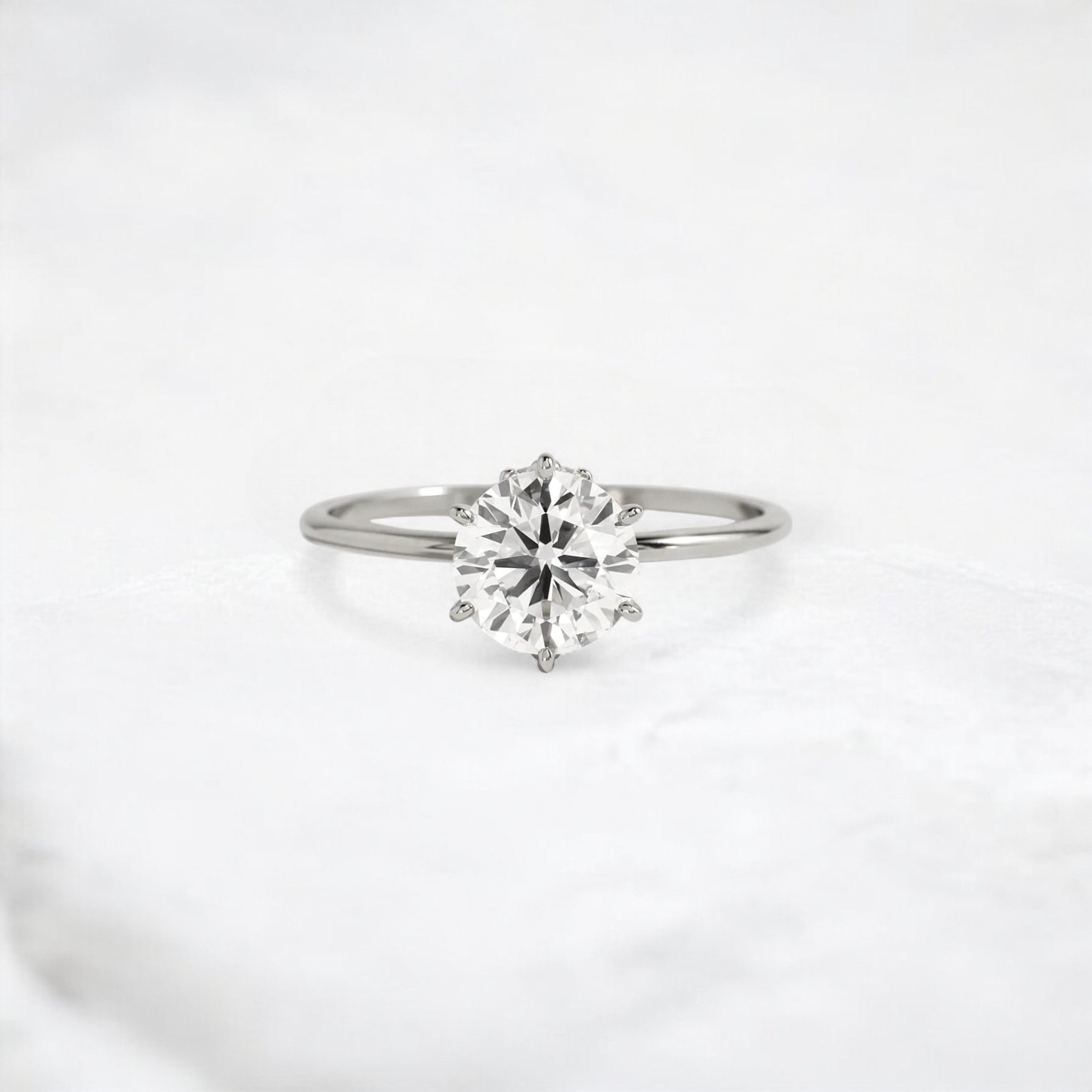blossom-shine-round-pear-accents-moissanite-solitaire-ring-1-20-ct-platinum-gemfora-1