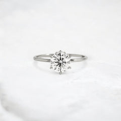 blossom-shine-round-pear-accents-moissanite-solitaire-ring-1-20-ct-platinum-gemfora-1