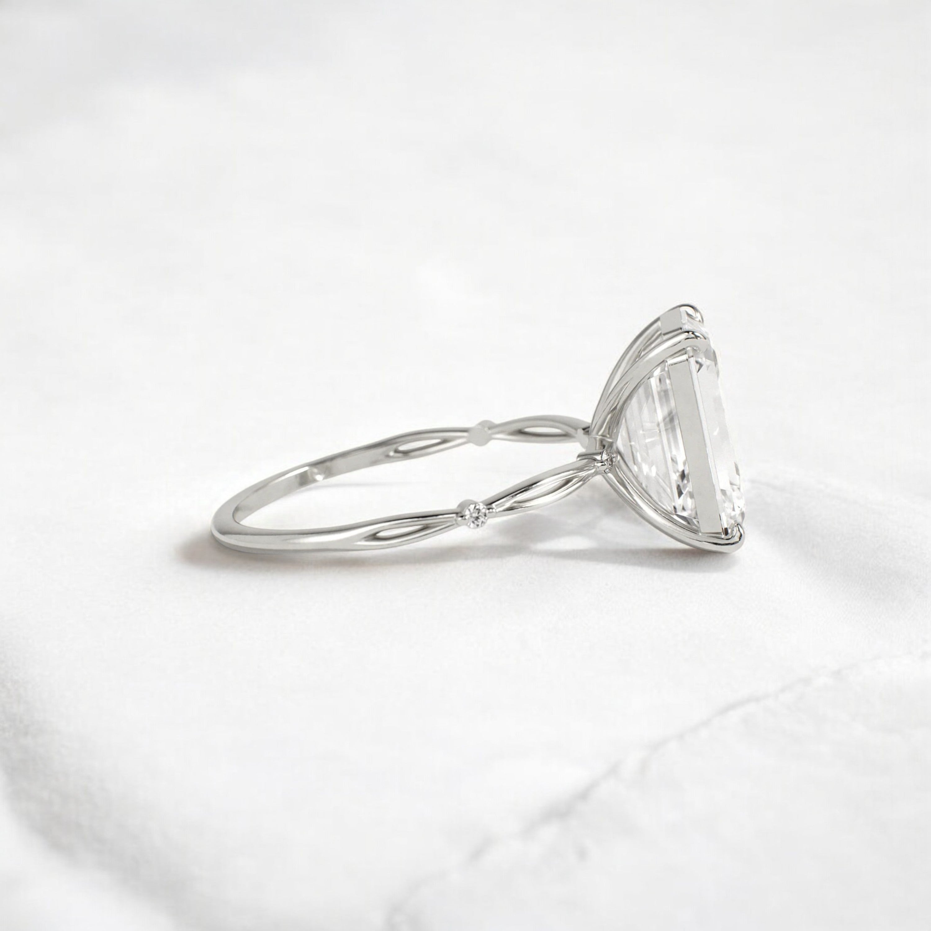 emerald-cut-engagement-ring-classic-crossed-moissanite-band-4-ct-platinum-gemfora-3