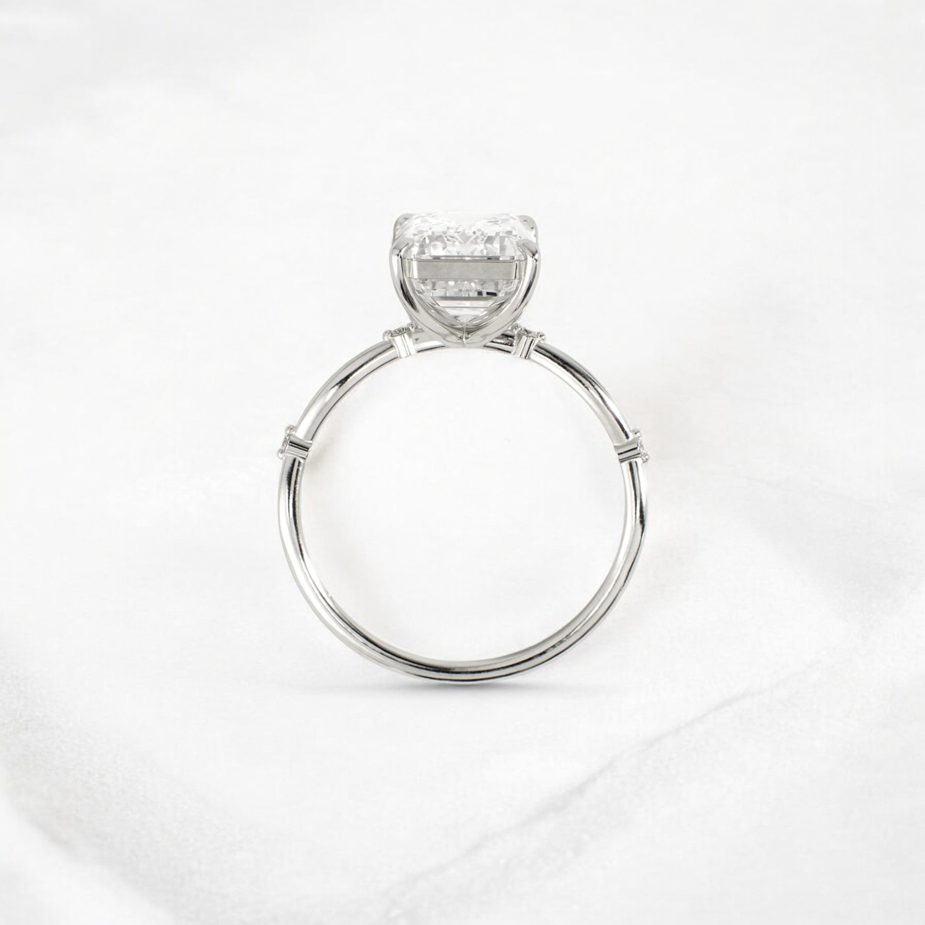 emerald-cut-engagement-ring-classic-crossed-moissanite-band-4-ct-platinum-gemfora-4