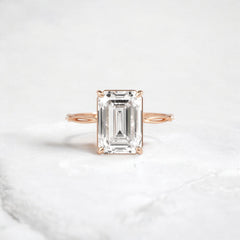emerald-cut-engagement-ring-classic-crossed-moissanite-band-4-ct-rose-gold-gemfora-1