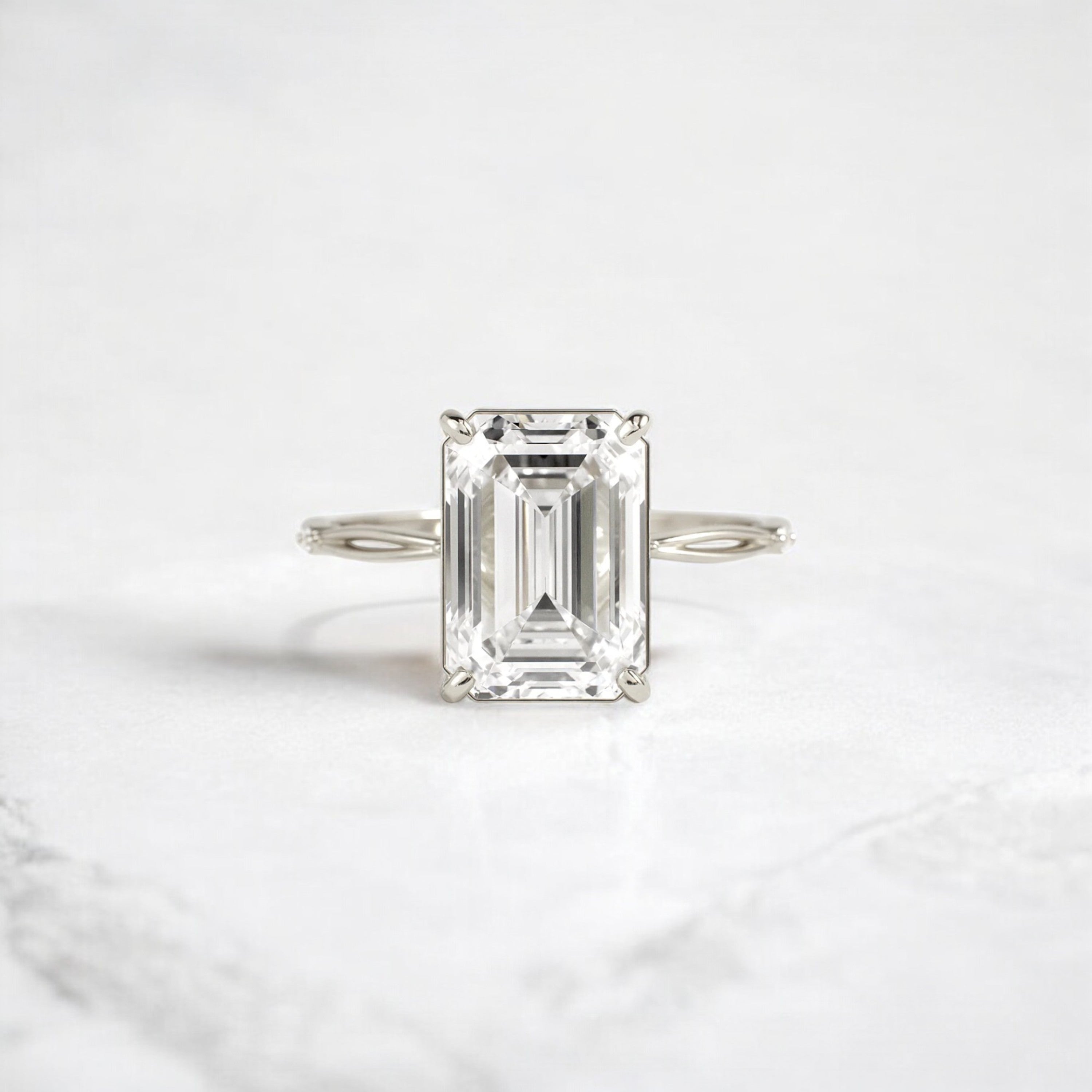 emerald-cut-engagement-ring-classic-crossed-moissanite-band-4-ct-white-gold-gemfora-1