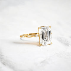 emerald-cut-engagement-ring-classic-crossed-moissanite-band-4-ct-yellow-gold-gemfora-2
