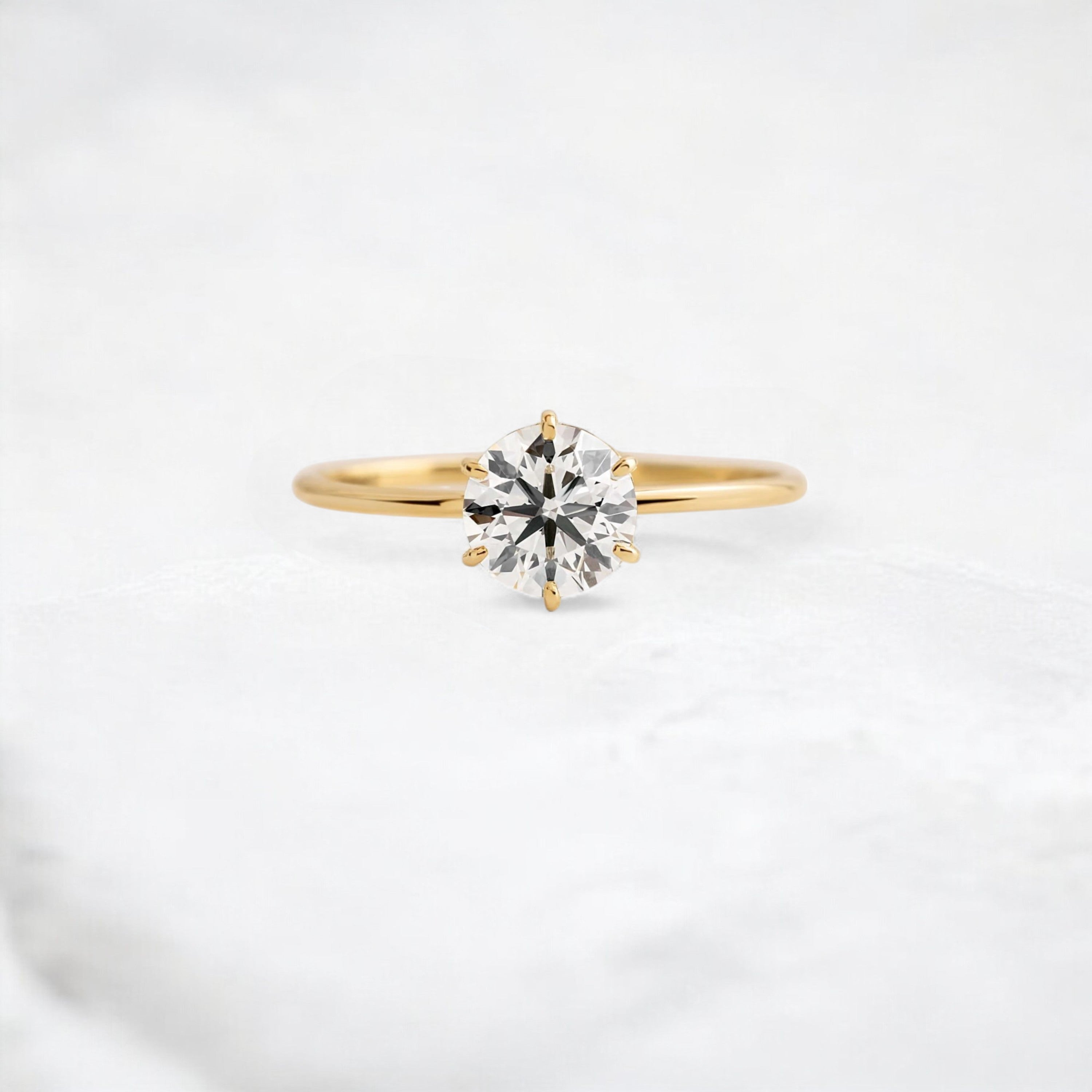 endless-love-round-moissanite-ring-in-golden-embrace-shine-1-ct-yellow-gold-gemfora-1
