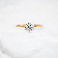 endless-love-round-moissanite-ring-in-golden-embrace-shine-1-ct-yellow-gold-gemfora-1