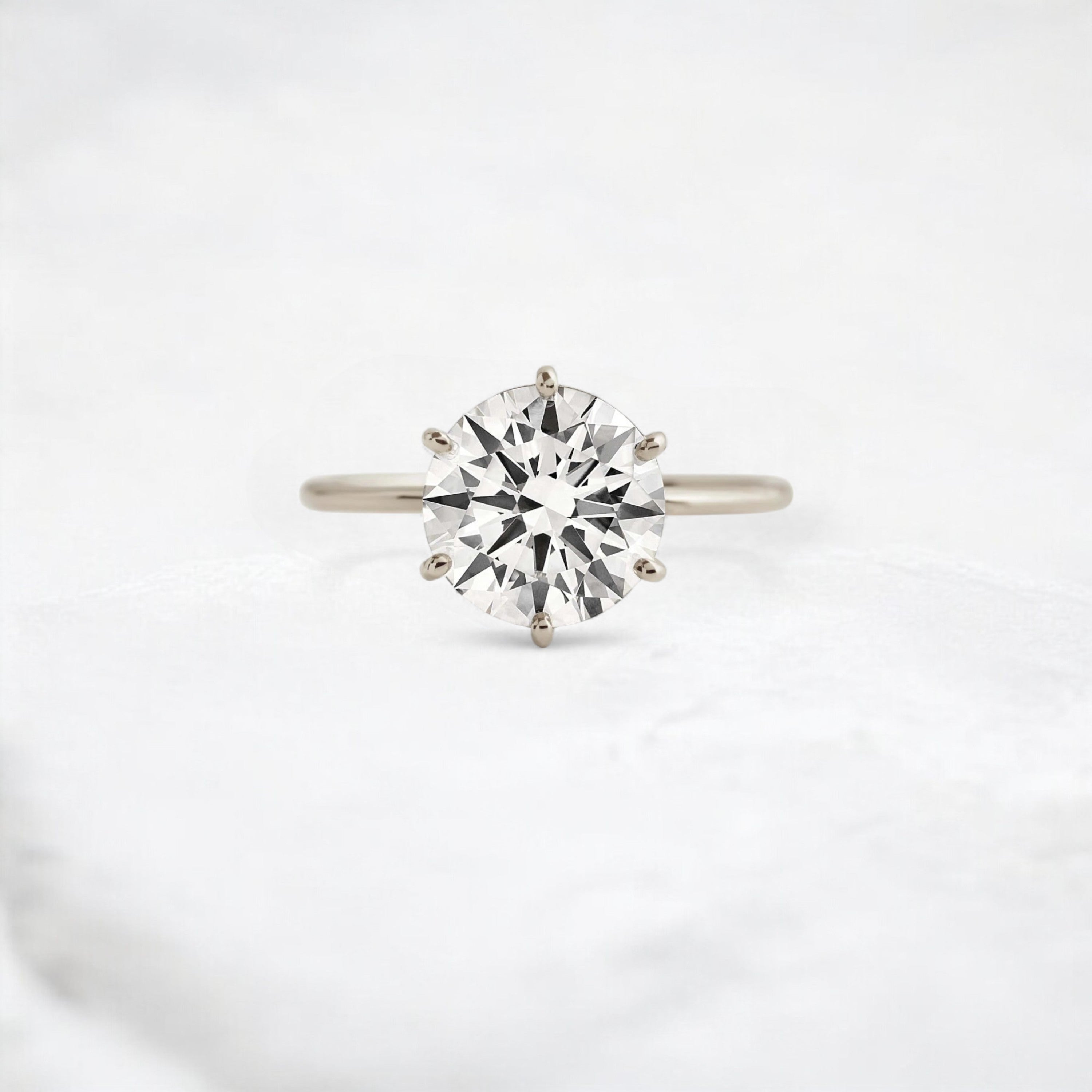 endless-love-round-moissanite-ring-in-golden-embrace-shine-2-4-ct-white-gold-gemfora-1