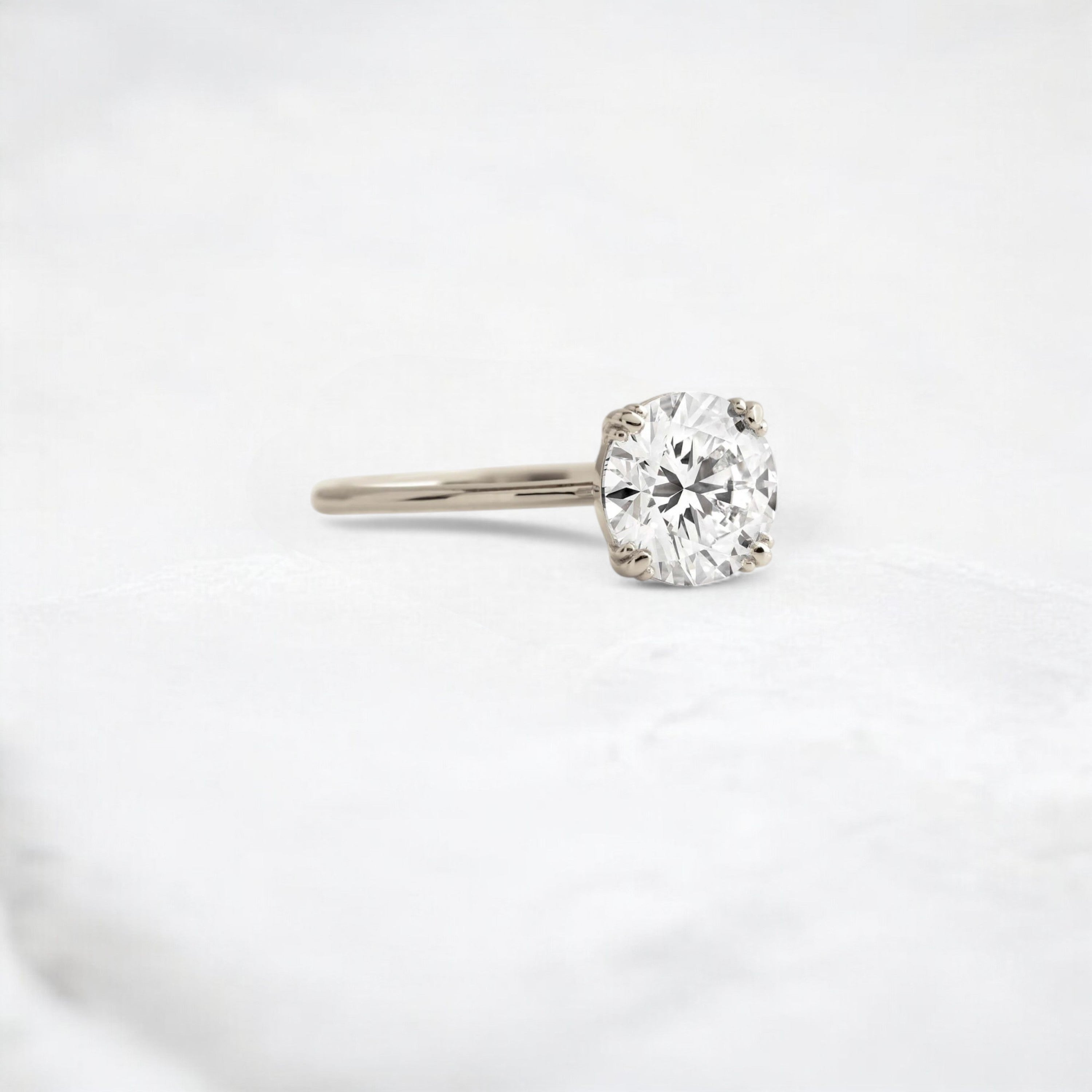 eternal-light-round-cut-moissanite-ring-4-prong-in-gold-shine-1-66-ct-white-gemfora-2