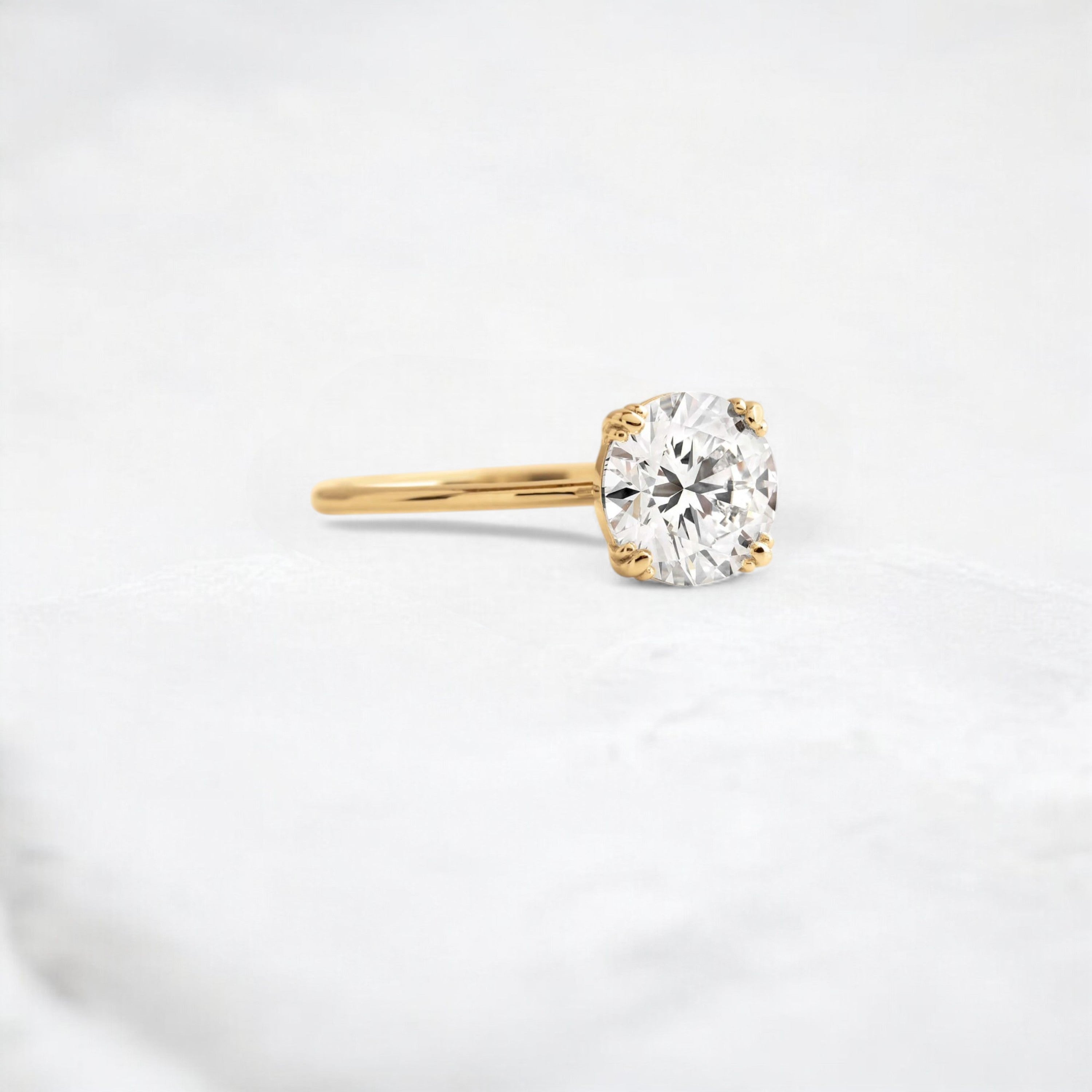 eternal-light-round-cut-moissanite-ring-4-prong-in-gold-shine-1-66-ct-yellow-gemfora-2