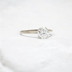 eternal-light-round-cut-moissanite-ring-4-prong-in-gold-shine-1-ct-white-gemfora-2