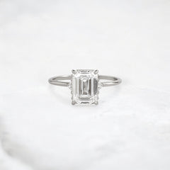 ethereal-flame-emerald-three-stone-moissanite-engagement-ring-2-ct-platinum-gemfora-1