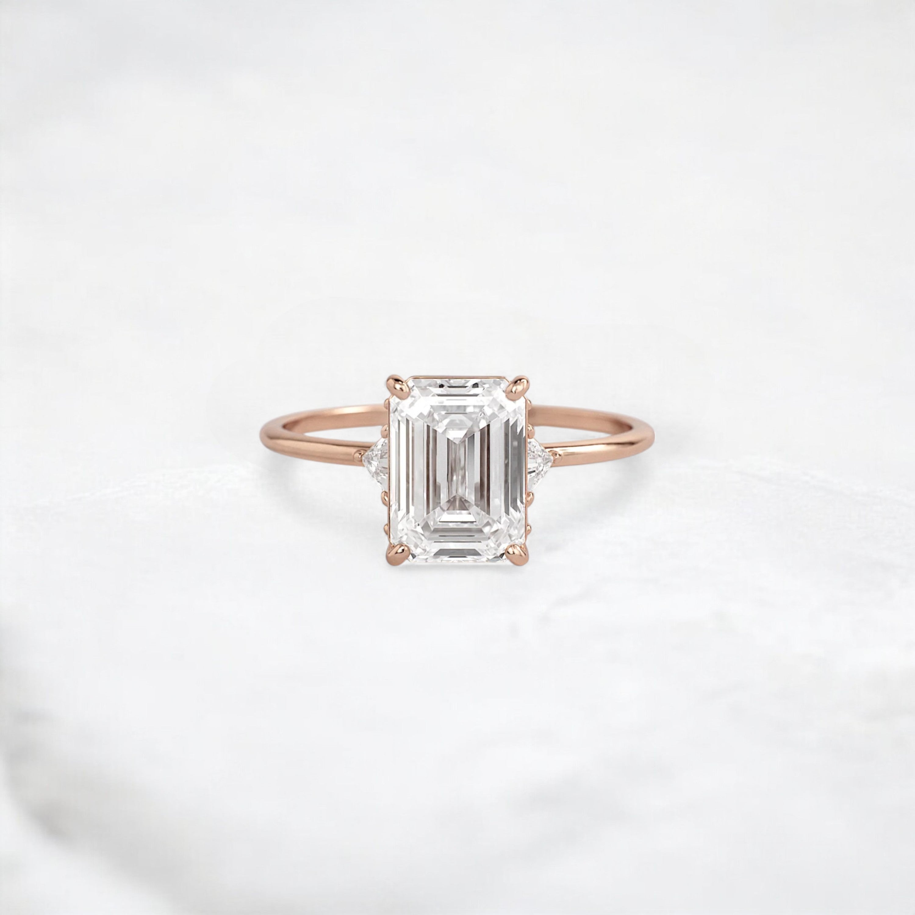 ethereal-flame-emerald-three-stone-moissanite-engagement-ring-2-ct-rose-gold-gemfora-1