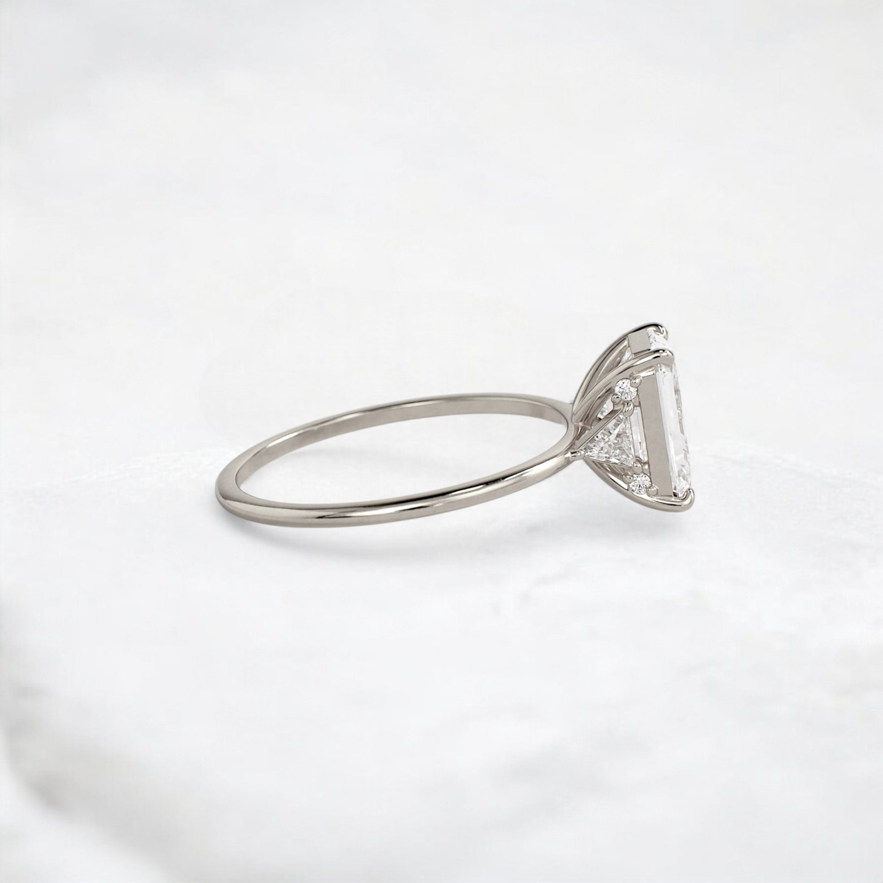 ethereal-flame-emerald-three-stone-moissanite-engagement-ring-2-ct-white-gold-gemfora-3