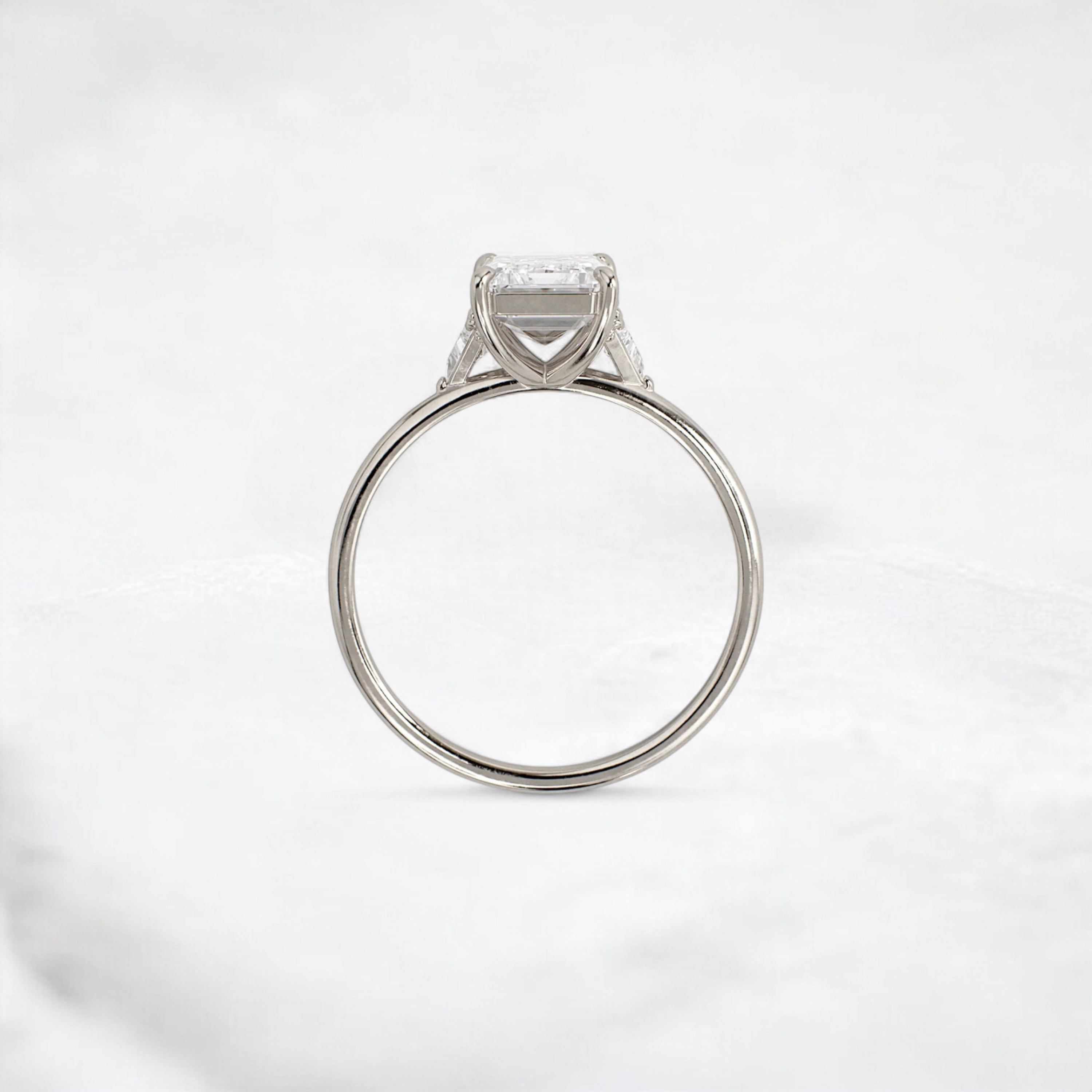 ethereal-flame-emerald-three-stone-moissanite-engagement-ring-2-ct-white-gold-gemfora-4