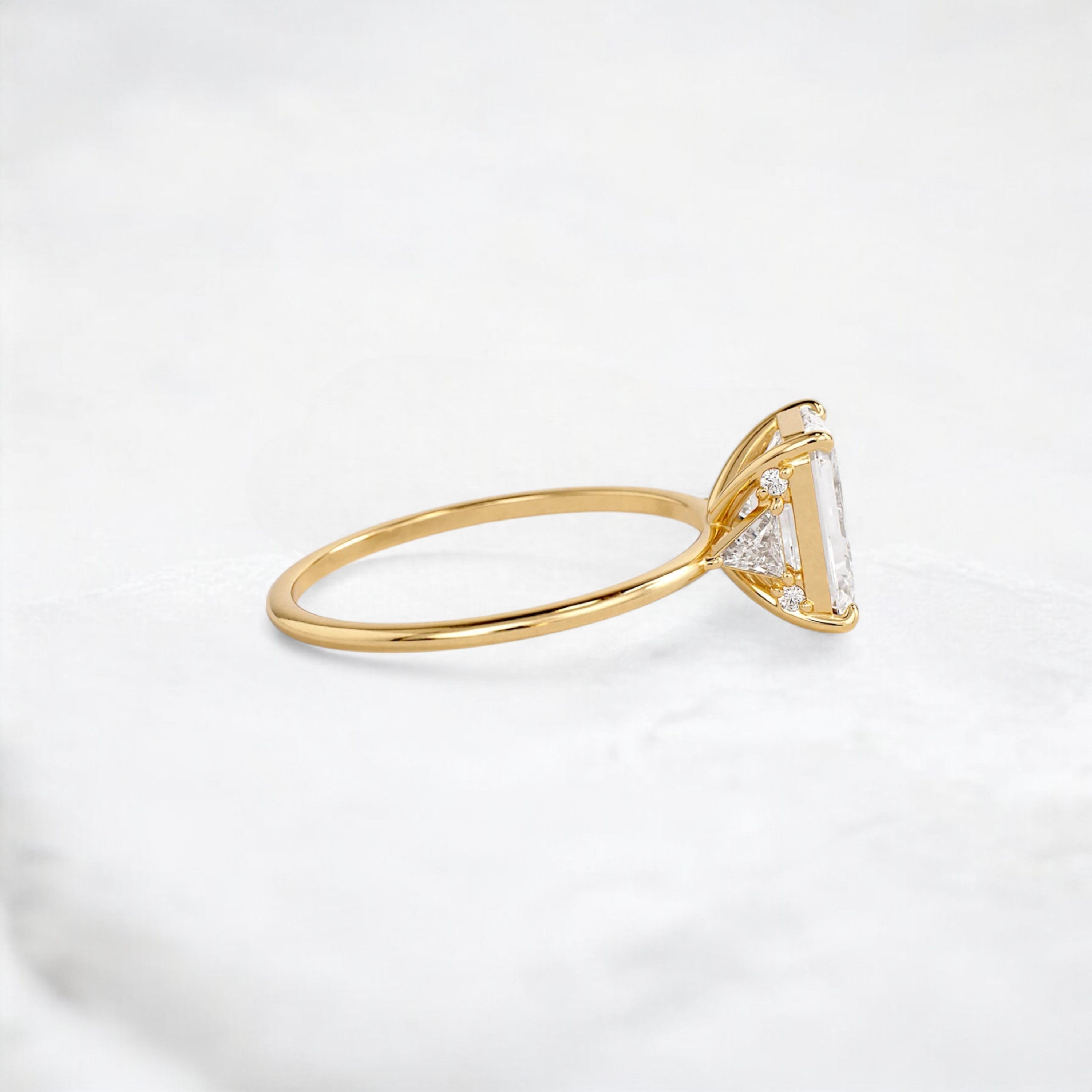 ethereal-flame-emerald-three-stone-moissanite-engagement-ring-2-ct-yellow-gemfora-3