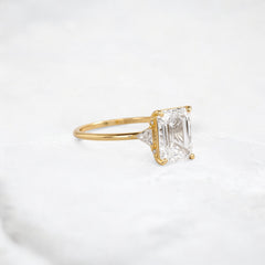 ethereal-flame-emerald-three-stone-moissanite-engagement-ring-2-ct-yellow-gold-gemfora-2