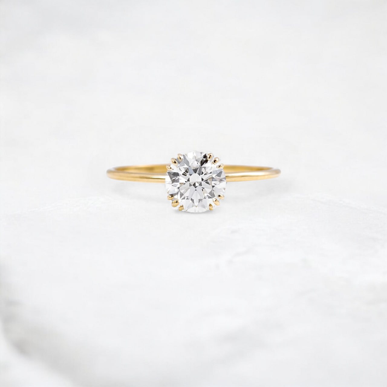 golden-dawn-round-cut-heartbeat-moissanite-engagement-ring-1-ct-yellow-gold-gemfora-1