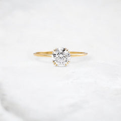 golden-dawn-round-cut-heartbeat-moissanite-engagement-ring-1-ct-yellow-gold-gemfora-1