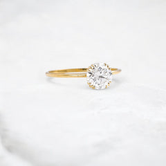 golden-dawn-round-cut-heartbeat-moissanite-engagement-ring-1-ct-yellow-gold-gemfora-2