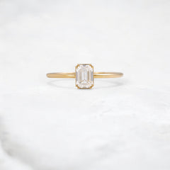 golden-lumen-emerald-solitaire-moissanite-engagement-ring-0-70-ct-yellow-gold-gemfora-1