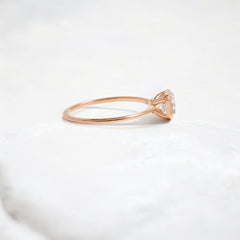 Elegant handmade emerald cut diamond engagement ring, featuring a bezel setting designed for women.