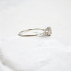 Elegant handmade emerald cut diamond engagement ring, featuring a bezel setting designed for women.