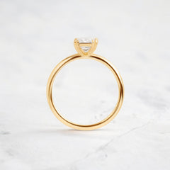 handmade-double-prong-emerald-solitaire-moissanite-engagement-ring-0-90-ct-yellow-gold-gemfora