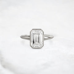hidden-muse-emerald-glow-bezel-moissanite-engagement-ring-3-ct-platinum-gemfora-1