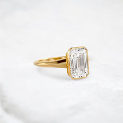 hidden-muse-emerald-glow-bezel-moissanite-engagement-ring-3-ct-yellow-gold-gemfora-2