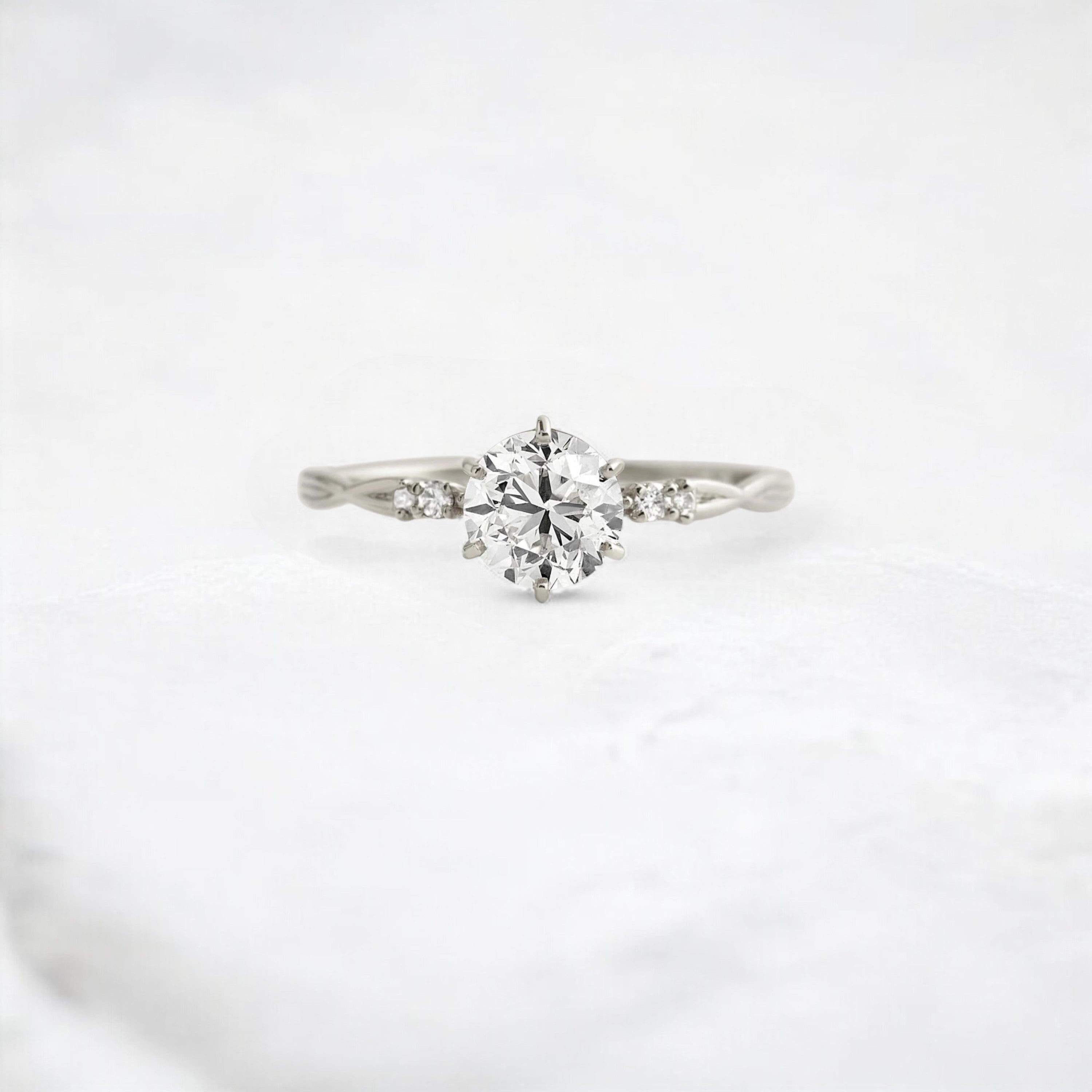 infinite-shine-round-curved-love-moissanite-engagement-ring-0-9-ct-platinum-gemfora-1