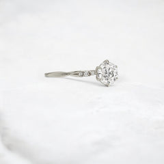 infinite-shine-round-curved-love-moissanite-engagement-ring-0-9-ct-platinum-gemfora-2