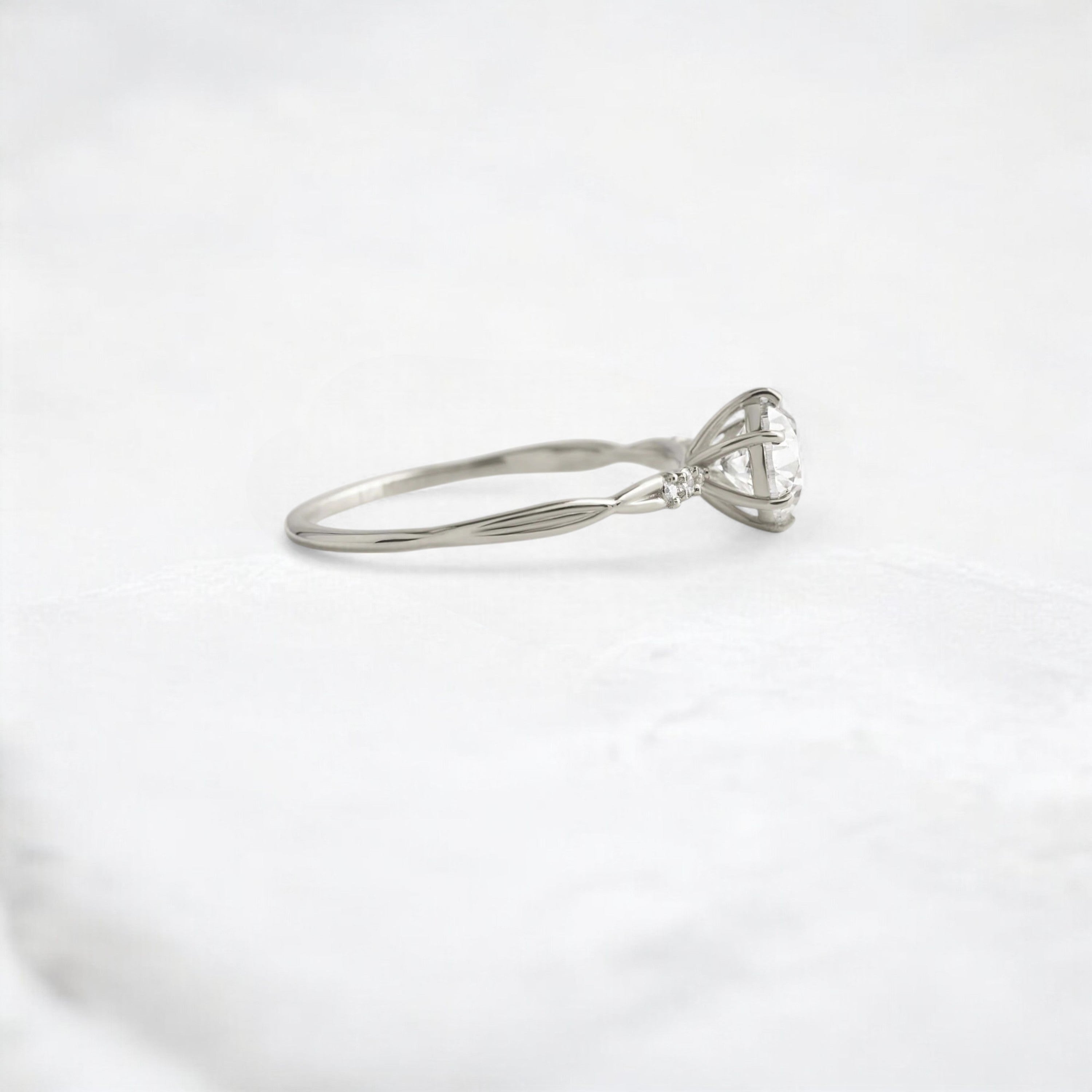 infinite-shine-round-curved-love-moissanite-engagement-ring-0-9-ct-platinum-gemfora-3