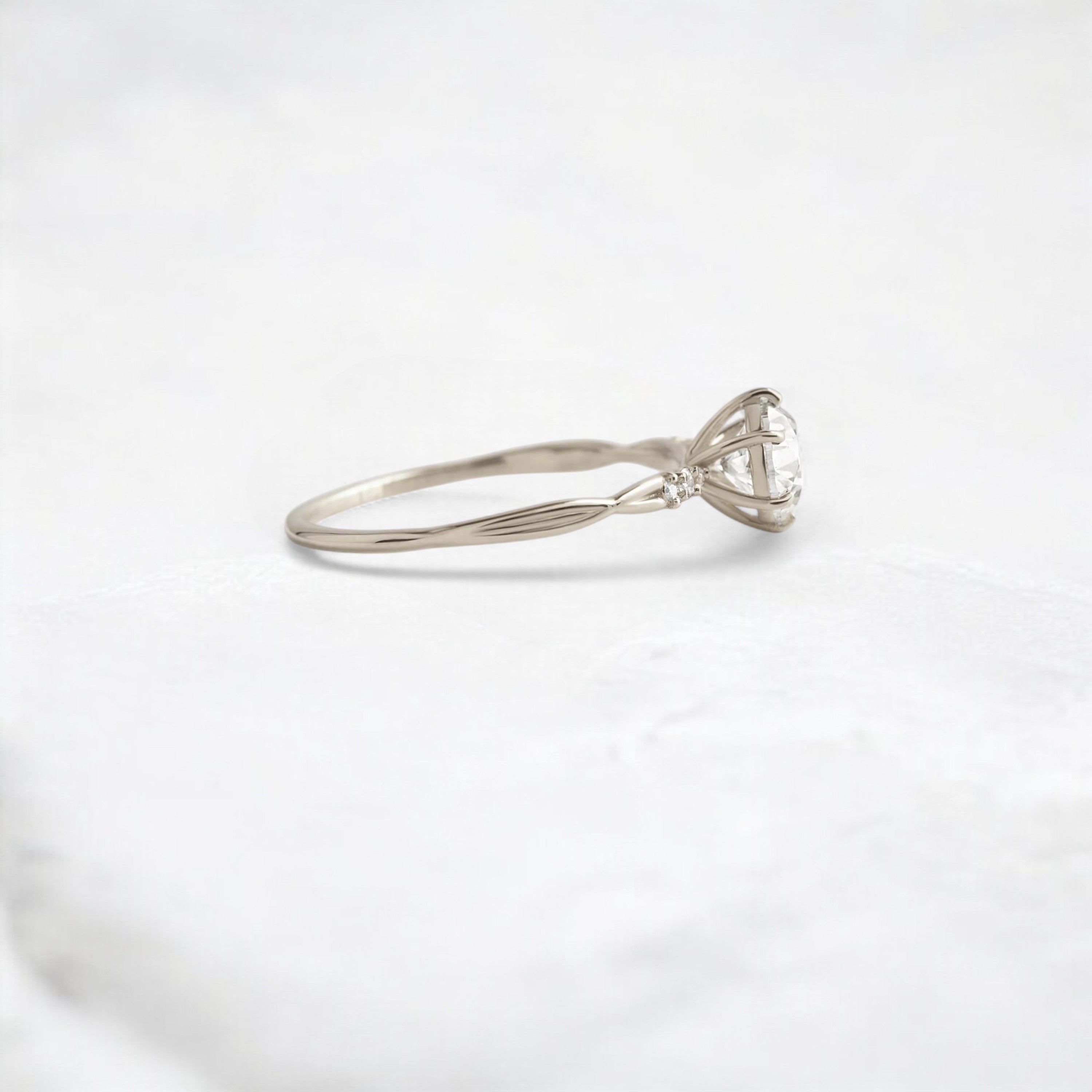 infinite-shine-round-curved-love-moissanite-engagement-ring-0-9-ct-white-gold-gemfora-3
