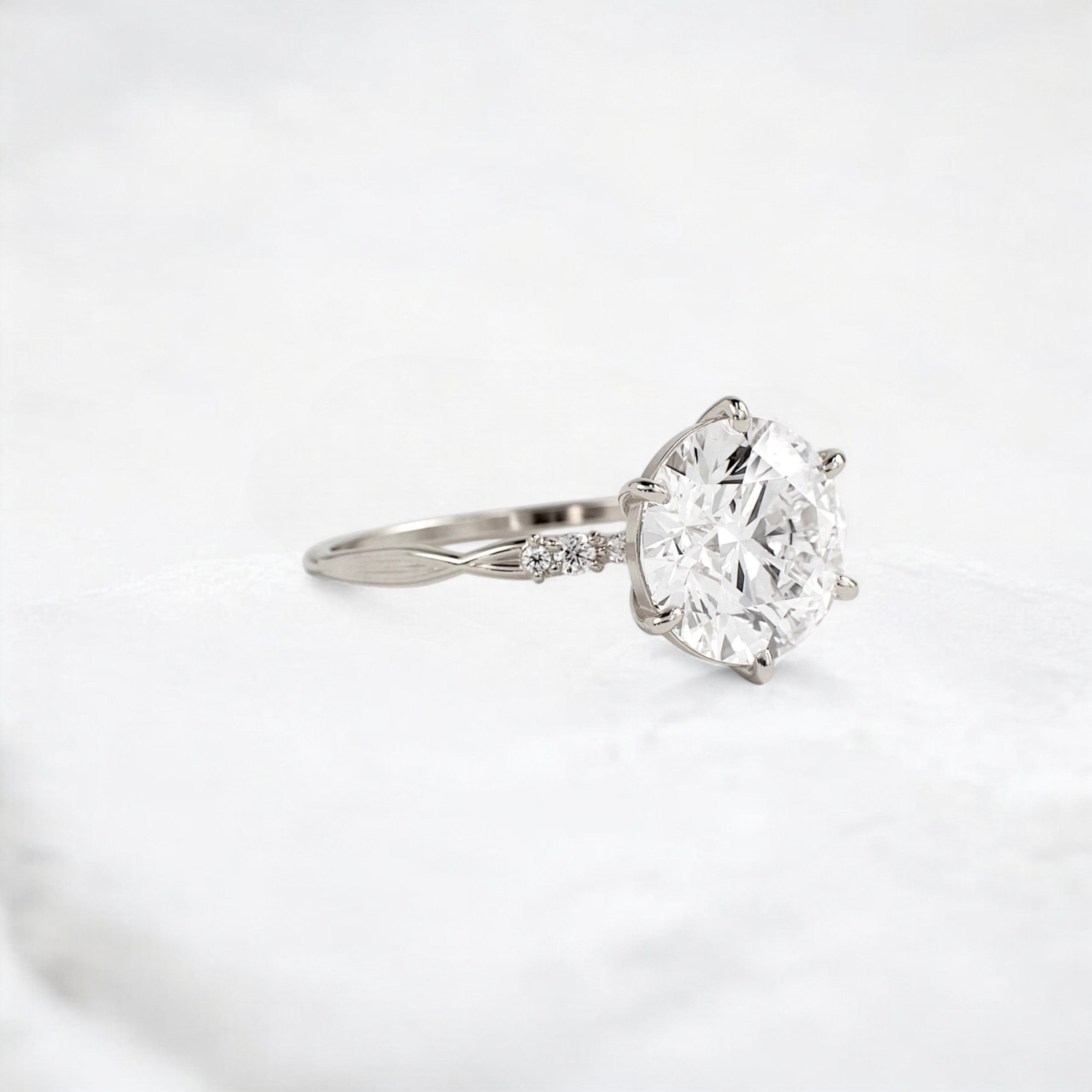 infinite-shine-round-curved-love-moissanite-engagement-ring-3-ct-white-gold-gemfora-2