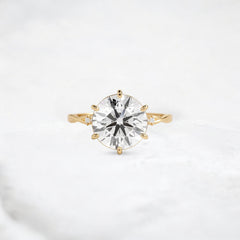 infinite-shine-round-curved-love-moissanite-engagement-ring-3-ct-yellow-gold-gemfora-1