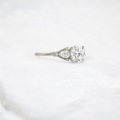 Morning Light, Bloom Petal Round Moissanite Engagement Ring