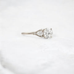 Morning Light, Bloom Petal Round Moissanite Engagement Ring