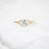 morning-light-bloom-petal-round-moissanite-engagement-ring-0-9-ct-yellow-gold-gemfora-1