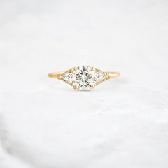 morning-light-bloom-petal-round-moissanite-engagement-ring-0-9-ct-yellow-gold-gemfora-1