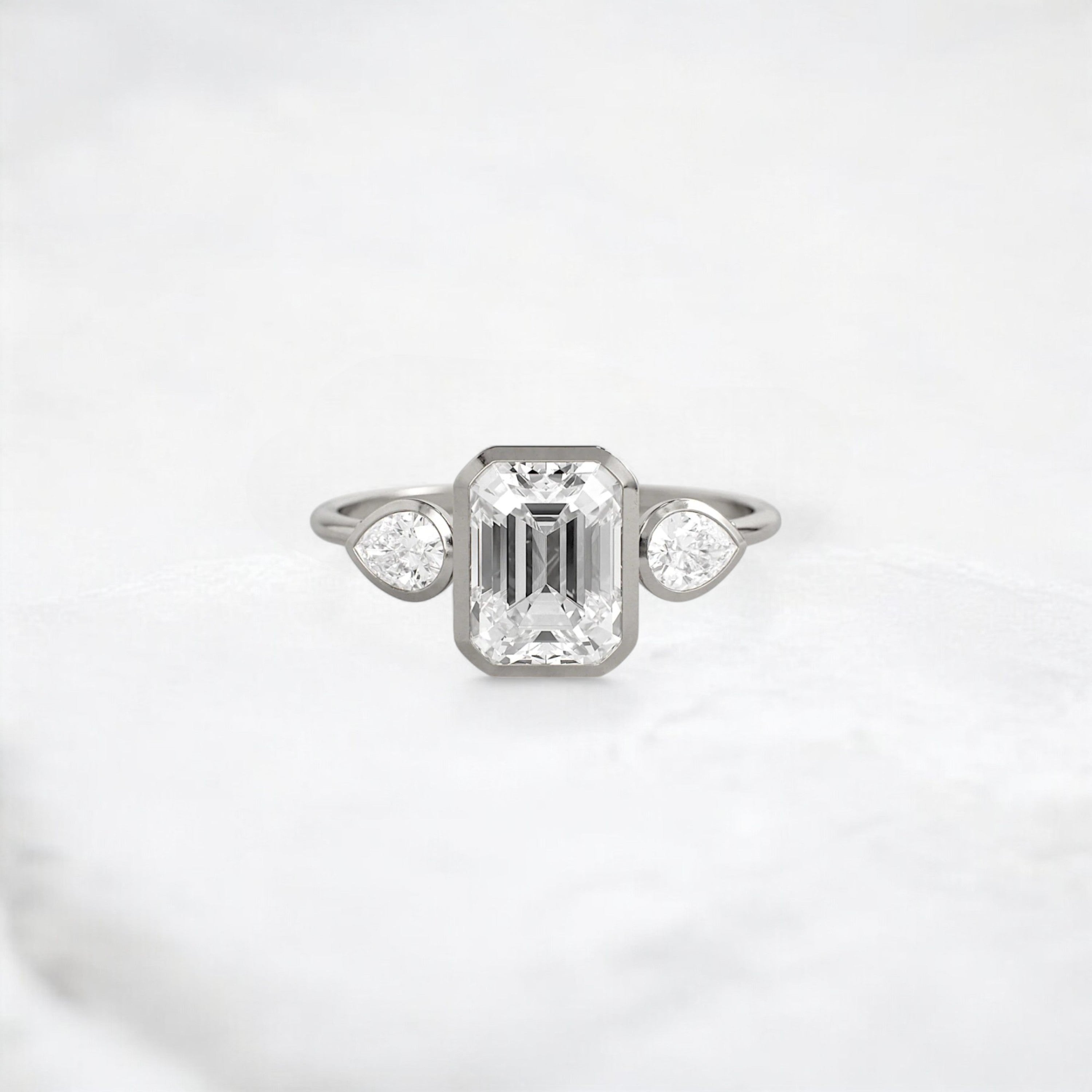 royal-whisper-emerald-bezel-hidden-moissanite-engagement-ring-1-5-ct-platinum-gemfora-1