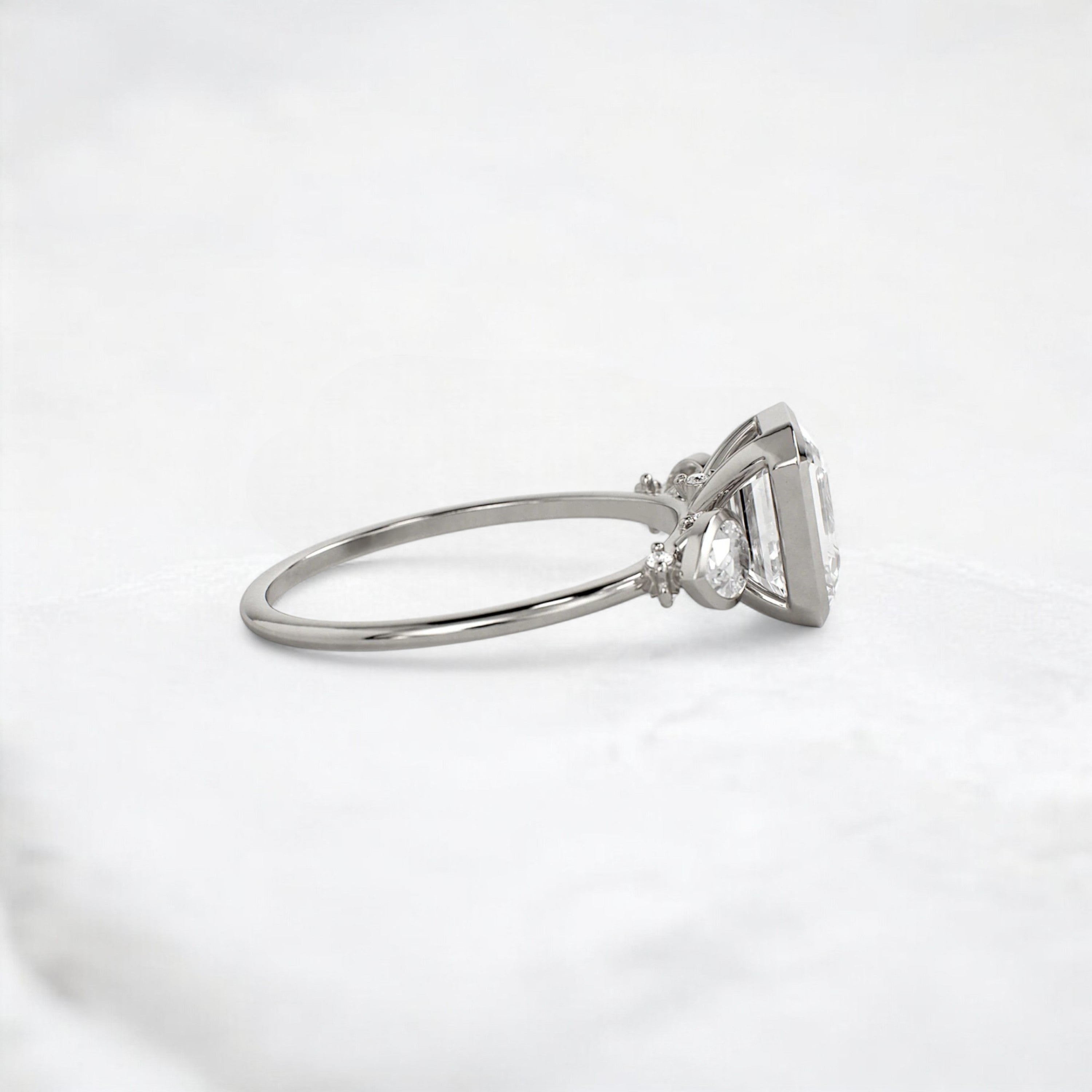 royal-whisper-emerald-bezel-hidden-moissanite-engagement-ring-1-5-ct-platinum-gemfora-3