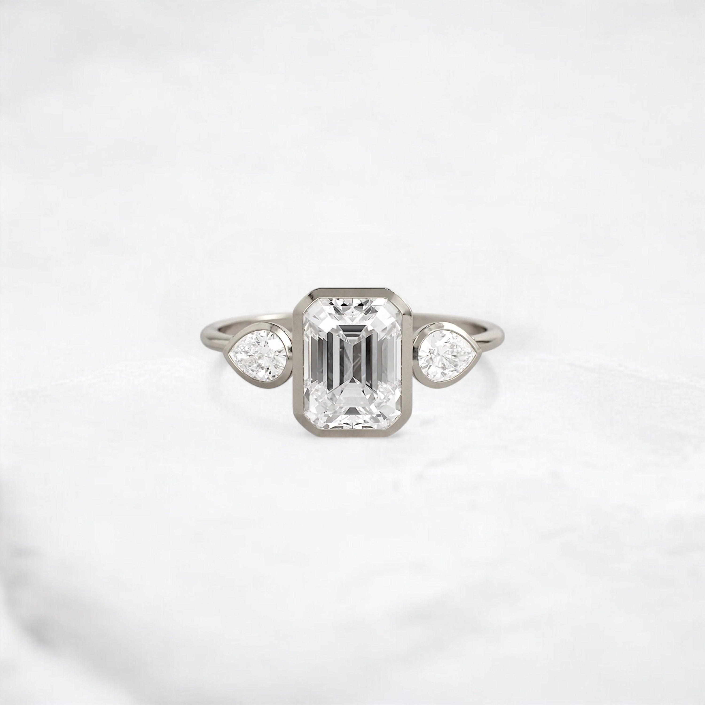 royal-whisper-emerald-bezel-hidden-moissanite-engagement-ring-1-5-ct-white-gold-gemfora-1