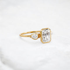 royal-whisper-emerald-bezel-hidden-moissanite-engagement-ring-1-5-ct-yellow-gold-gemfora-2