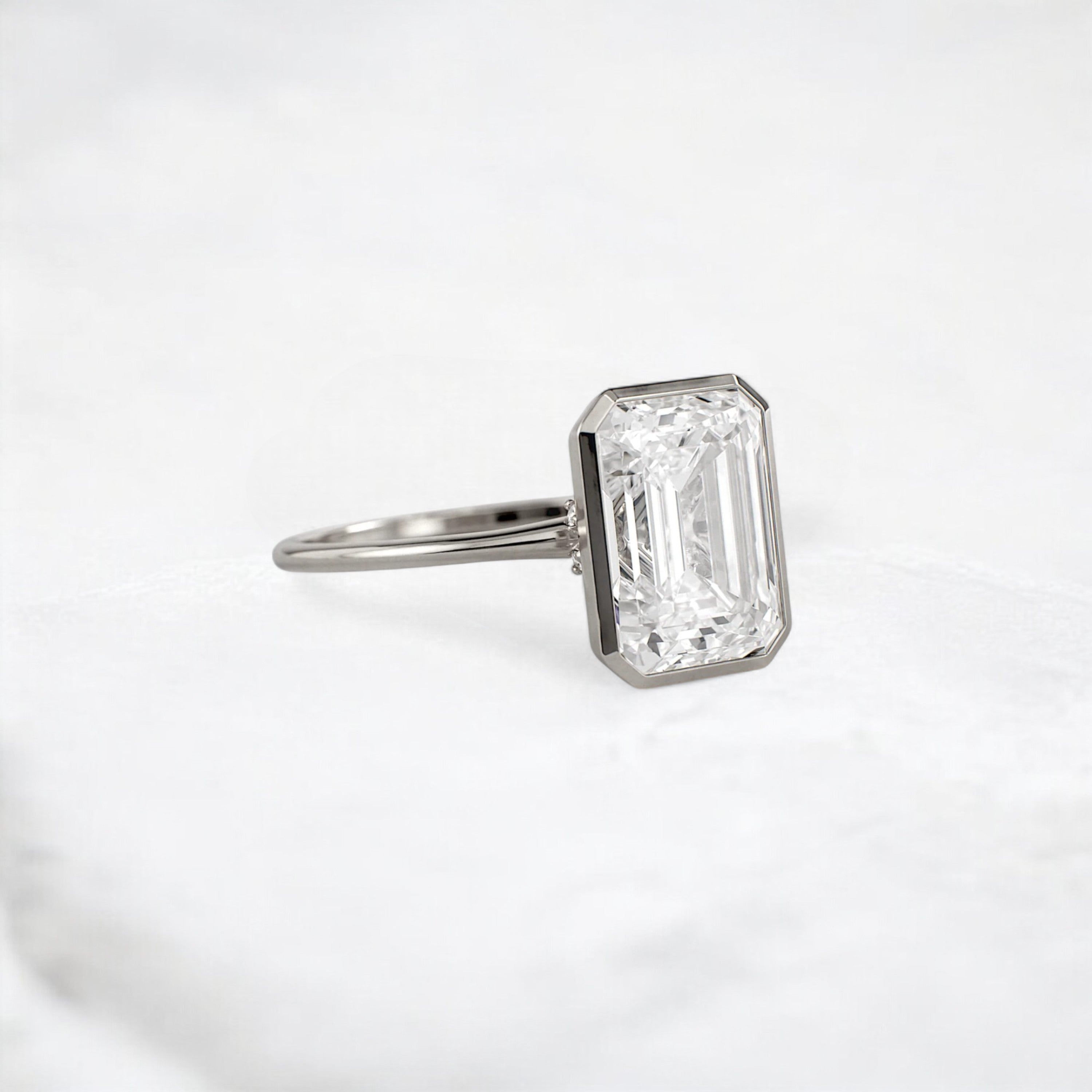 secret-glimmer-emerald-cut-bezel-moissanite-engagement-ring-4-ct-platinum-gemfora-2