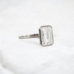 secret-glimmer-emerald-cut-bezel-moissanite-engagement-ring-4-ct-platinum-gemfora-2